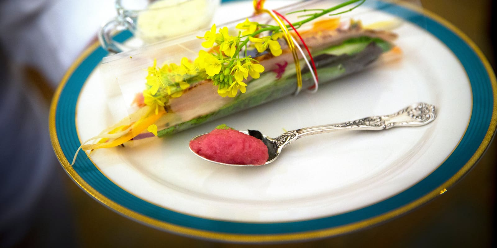 An elegantly plated gourmet dish with edible flowers